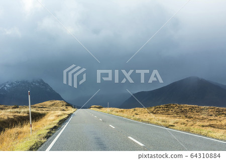 Open 2 lane road in rural countryside. Weather Open 2 lane road in rural countryside. Weather 64310884