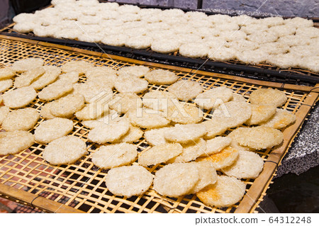 Dried crackers on the back street of Luang Prabang Dried crackers on the back street of Luang Prabang 64312248