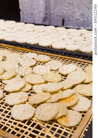 Dried crackers on the back street of Luang Prabang Dried crackers on the back street of Luang Prabang 64312249