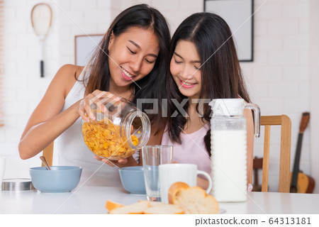 Happy asian lesbian woman couple have breakfast at Happy asian lesbian woman couple have breakfast at 64313181