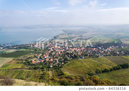 Aerial view of Pavlov village from Devin mountain on banks of Nove Mlyny water reservoir, Breclav district, South Moravia, Czech Republic, sunny summer day Aerial view of Pavlov village from Devin mountain on banks of Nove Mlyny water reservoir, Breclav district, South Moravia, Czech Republic, sunny summer day 64316316