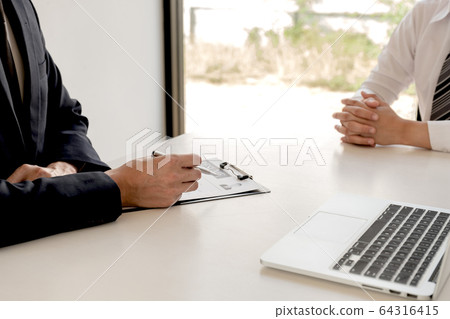 Business people hold a job profile and talk to job 64316415