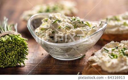 A bowl of homemade cream cheese spread with A bowl of homemade cream cheese spread with 64316913