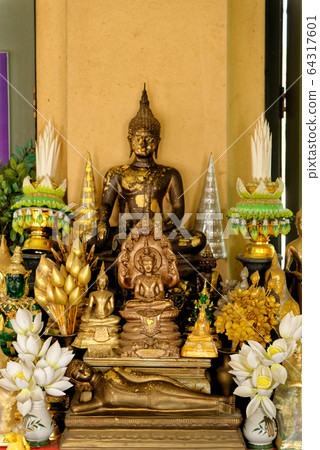 Buddha statues in Wat Niwet Thammaprawat temple 64317601