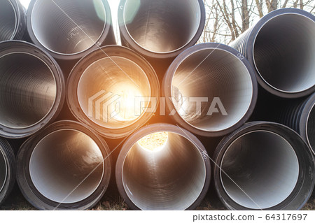 Modern polypropylene pipes for conducting heating mains underground. Durable and anticorrosive properties of water pipes, drainage system Modern polypropylene pipes for conducting heating mains underground. Durable and anticorrosive properties of water pipes, drainage system 64317697