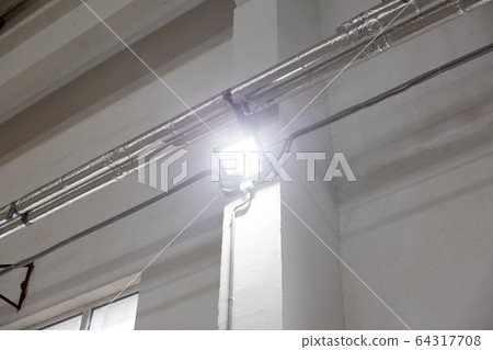 Modern LED spotlight for indoor lighting. The concept of conservation of electricity, lighting 64317708