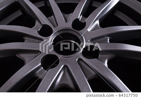 Landing hole in a cast modern car disk, background, industry Landing hole in a cast modern car disk, background, industry 64317750