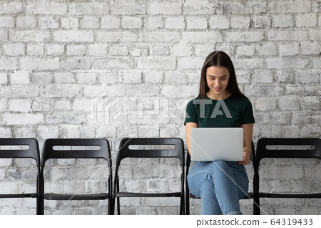 Female job applicant use laptop preparing for interview Female job applicant use laptop preparing for interview 64319433