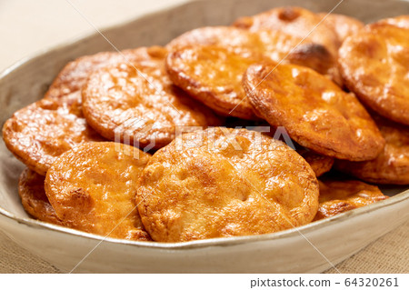 Soy sauce rice cracker. 64320261