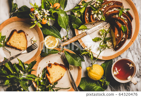 Homemade Lemon cake, citrus tree blossom branches Homemade Lemon cake, citrus tree blossom branches 64320476