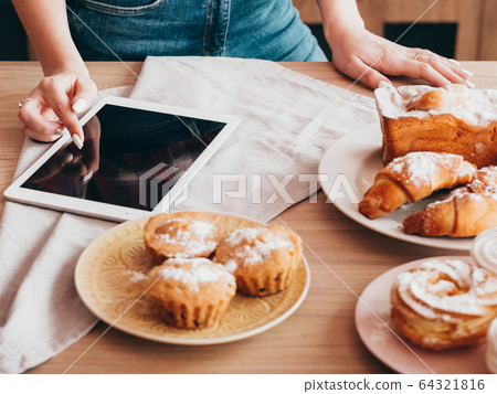 online cookbook homemade bakery food woman tablet 64321816