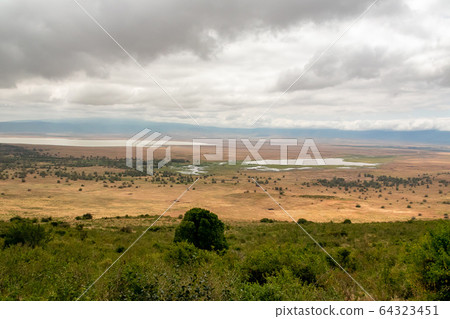 View the grasslands and mountains from the mountain path in Ngorongoro, Tanzania 32 View the grasslands and mountains from the mountain path in Ngorongoro, Tanzania 32 64323451