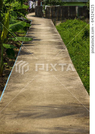 Long concrete walkway 64324125