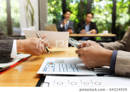 Business team meeting and discussing project plan. Business team meeting and discussing project plan. 64324939