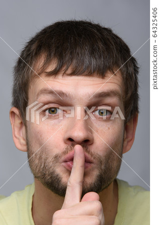 Portrait of a man of European appearance who put a 64325406
