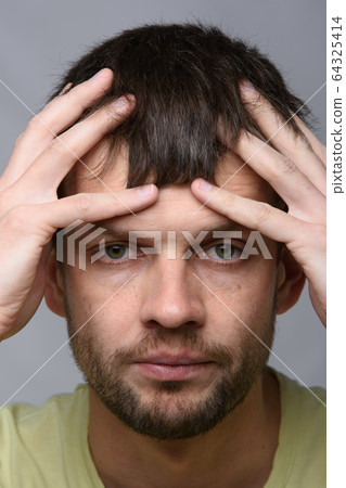 Close-up portrait of a man of European appearance Close-up portrait of a man of European appearance 64325414