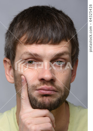 Closeup portrait of a sad and pensive man of Closeup portrait of a sad and pensive man of 64325416