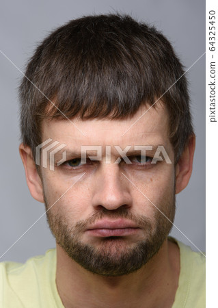 Closeup portrait of a nasty man of European 64325450