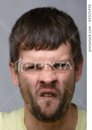 Closeup portrait of an ugly man of European 64325456