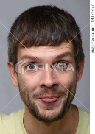 Portrait of a cheerful man of European appearance 64325457