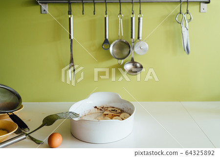 Cooking torrijas, a typical Spanish sweet fried toasts of sliced bread soaked in eggs and milk. Cooking torrijas, a typical Spanish sweet fried toasts of sliced bread soaked in eggs and milk. 64325892