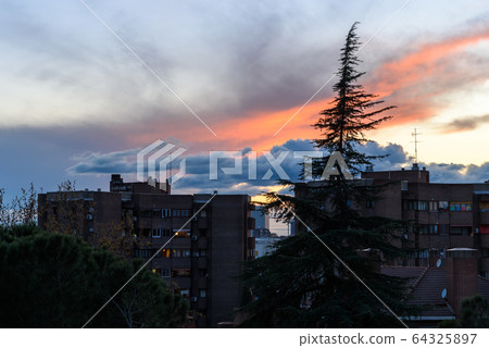 Dramatic sunset on cityscape of Madrid. Global warming concept Dramatic sunset on cityscape of Madrid. Global warming concept 64325897