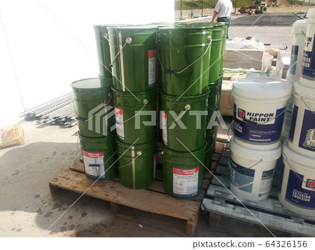 Paint buckets stacked at the construction site. Ready to used by the painter for internal and external painting work. Paint buckets stacked at the construction site. Ready to used by the painter for internal and external painting work. 64326156