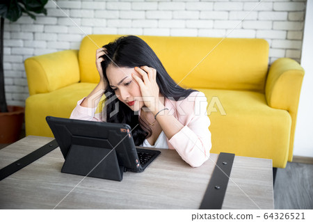 moody woman with tablet moody woman with tablet 64326521