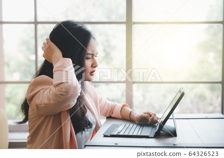 moody woman with tablet moody woman with tablet 64326523