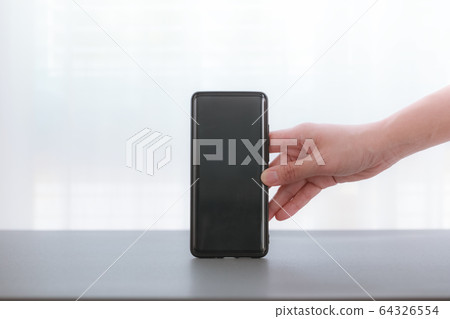 woman hands holding smartphone woman hands holding smartphone 64326554