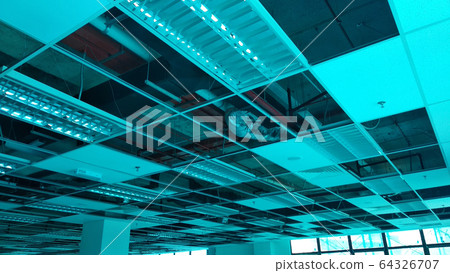 Suspended ceiling frame and board under construction at the construction site. Electrical and mechanical fitting installation work also on going.  64326707