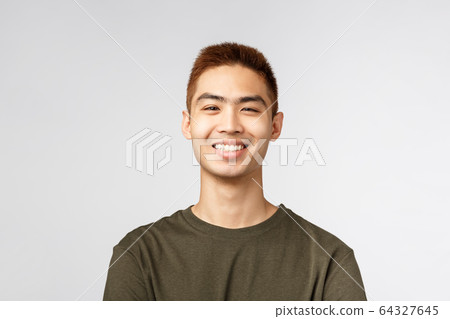 Close-up portrait of satisfied, cheerful nice young male student, asian man look enthusiastic with beaming smile, feeling rejoice and upbeat feeling, standing grey background joyful Close-up portrait of satisfied, cheerful nice young male student, asian man look enthusiastic with beaming smile, feeling rejoice and upbeat feeling, standing grey background joyful 64327645