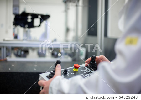 Quality engineer measuring some moldings, components by professional 3D measuring system machine, industrial concept Quality engineer measuring some moldings, components by professional 3D measuring system machine, industrial concept 64329248
