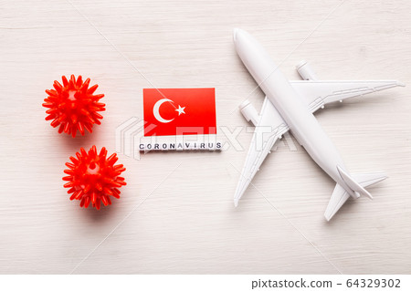 Flight ban and closed borders for tourists and travelers with coronavirus covid-19. Airplane and flag of Turkey on a white background. Coronavirus pandemic. 64329302