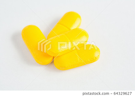 bunch of capsules on white background bunch of capsules on white background 64329627