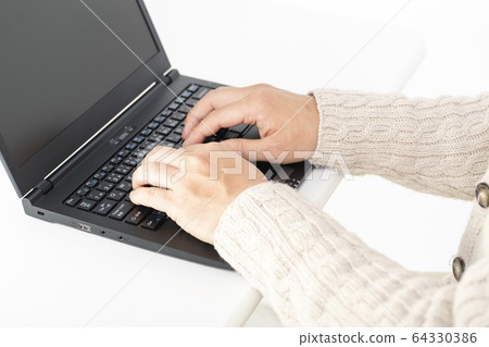 A man working on a laptop 64330386