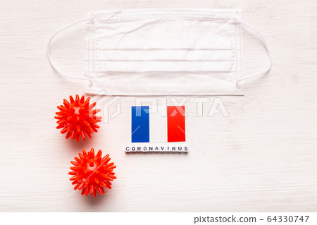 Coronavirus 2019-nCoV concept. Top view protective breathing mask and flag of France. Novel Chinese Coronavirus outbreak. Coronavirus 2019-nCoV concept. Top view protective breathing mask and flag of France. Novel Chinese Coronavirus outbreak. 64330747