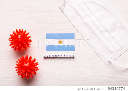 Coronavirus 2019-nCoV concept. Top view protective breathing mask and flag of Argentina. Novel Chinese Coronavirus outbreak. 64330774