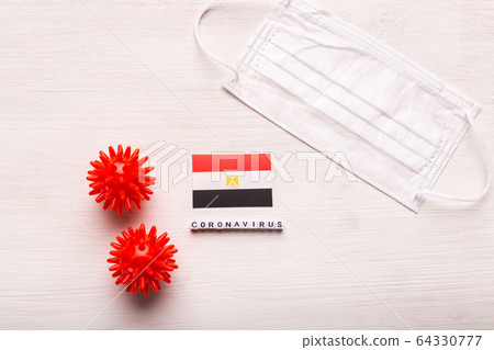 Coronavirus 2019-nCoV concept. Top view protective breathing mask and flag of Egypt. Novel Chinese Coronavirus outbreak. 64330777