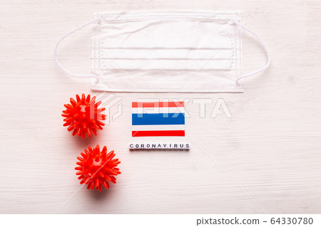 Coronavirus 2019-nCoV concept. Top view protective breathing mask and flag of Thailand. Novel Chinese Coronavirus outbreak. Coronavirus 2019-nCoV concept. Top view protective breathing mask and flag of Thailand. Novel Chinese Coronavirus outbreak. 64330780