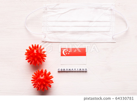 Coronavirus 2019-nCoV concept. Top view protective breathing mask and flag of Singapore. Novel Chinese Coronavirus outbreak. Coronavirus 2019-nCoV concept. Top view protective breathing mask and flag of Singapore. Novel Chinese Coronavirus outbreak. 64330781