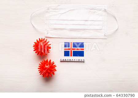 Coronavirus 2019-nCoV concept. Top view protective breathing mask and flag of Iceland. Novel Chinese Coronavirus outbreak. Coronavirus 2019-nCoV concept. Top view protective breathing mask and flag of Iceland. Novel Chinese Coronavirus outbreak. 64330790