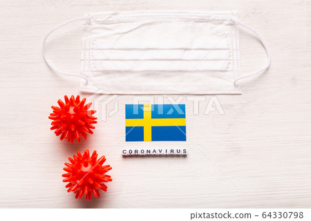 Coronavirus 2019-nCoV concept. Top view protective breathing mask and flag of Sweden. Novel Chinese Coronavirus outbreak. Coronavirus 2019-nCoV concept. Top view protective breathing mask and flag of Sweden. Novel Chinese Coronavirus outbreak. 64330798