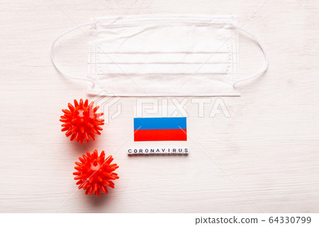 Coronavirus 2019-nCoV concept. Top view protective breathing mask and flag of Russia. Novel Chinese Coronavirus outbreak. Coronavirus 2019-nCoV concept. Top view protective breathing mask and flag of Russia. Novel Chinese Coronavirus outbreak. 64330799