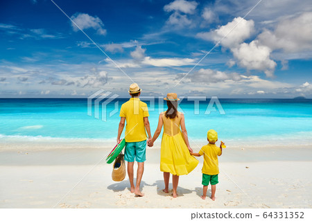Family with three year old boy on beach. Family with three year old boy on beach. 64331352