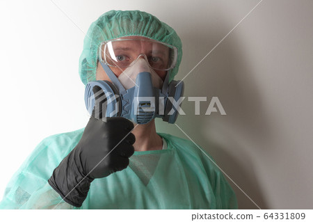 Male nurse, with   protective equipment to protect against the virus covid-19 in ICU in hospital. 64331809
