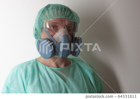 Male nurse  with   protective equipment to protect against the virus covid-19 in ICU in hospital. 64331811