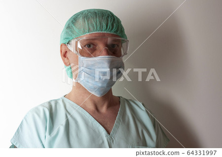 Male nurse, with plastic protective eyeglasses Male nurse, with plastic protective eyeglasses 64331997