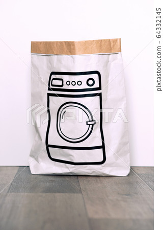 Paper craft package with a picture of the washing machine on the floor against the white background. Washbasin bag. 64332145