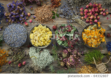 Dry medicinal herbs, top view. 64332807